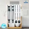 A product shot of mirror clips and mounting hardware, set against a blurred bathroom background. Produktbild-Vorschau