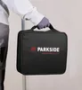 A person wearing gloves holds a black carrying case with the "PARKSIDE PERFORMANCE" logo. Podgląd zdjęcia produktu
