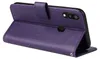 A purple flip cover case for a Samsung Galaxy A20e phone is shown from a side angle, standing upright. Produktbild-Vorschau