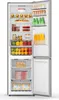 An open refrigerator with food items inside. Produktbild-Vorschau