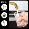 A hand holding a glass under a golden faucet as water pours into it. The image also features smaller inset images and text highlighting product features. Produktbild-Vorschau