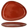 A top and side view of an irregularly shaped, reddish-brown ceramic plate with speckles. Produktbild-Vorschau