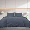 A bed with anthracite bedding in a modern bedroom setting. Voir les images du produit