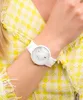 A close-up shot of a person's arm wearing a white watch. Náhled obrázku produktu