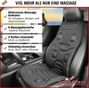 A black massage seat cushion is placed on a car seat, with text overlays describing its features. Produktbild-Vorschau