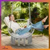 A woman is relaxing in a hanging chair outdoors, using a laptop. Voir les images du produit