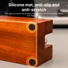 Close-up of the corner of a wooden product, highlighting its silicone anti-slip feet. Náhled obrázku produktu