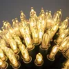 A close-up, low-angle shot of a string of warm white LED lights. Produktbild-Vorschau