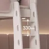 Close-up of a white ladder with steps on a bunk bed, showing a measurement of 330mm between two steps. Produktbild-Vorschau