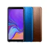 Three smartphones are displayed side-by-side against a white background. The phone on the left has its screen on, displaying a colorful wallpaper. The other two phones are shown from the back, with textured finishes. Náhled obrázku produktu