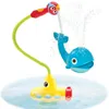A yellow submarine bath toy with a blue whale sprinkler attachment, spraying water. Anteprima dell’immagine prodotto