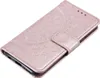 A rose gold flip phone case with a mandala pattern embossed on the cover, shown from a diagonal angle against a white background. Produktbild-Vorschau