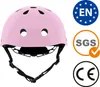 A pink helmet with certification logos on the side. Anteprima dell’immagine prodotto