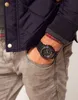 A person wearing a watch with their hand in their pocket. Náhľad obrázku produktu