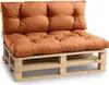 A close-up shot of a two-seater sofa cushion set made from orange fabric, placed on a wooden pallet base. Produktbild-Vorschau