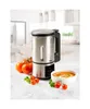 A soup maker is shown on a kitchen counter with tomatoes and a bowl of soup. Produktbild-Vorschau