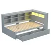 A 3D rendering of a grey daybed with built-in shelving and drawers, illuminated by soft yellow LED lights. Náhľad obrázku produktu