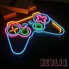 A neon sign shaped like a video game controller is displayed against a black background. Books are visible in the background. Produktbild-Vorschau