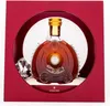 A bottle of Remy Martin Louis XIII cognac presented in a red gift box with a circular cutout. Produktbild-Vorschau