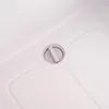 A close-up view of a drain plug on a white surface, possibly a cooler or refrigerator. Produktbild-Vorschau