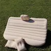 An inflatable car mattress and pillows are laid out on a grassy lawn. Produktbild-Vorschau