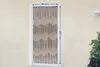 A beaded curtain hanging in a doorway, with dimensions indicated. Produktbild-Vorschau