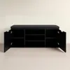 A black shoe cabinet with a black upholstered seat on top, shown with its two doors open. Náhľad obrázku produktu