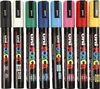 A row of eight Posca markers in different colors, standing upright against a white background. Voir les images du produit