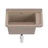 A beige sink with a drain and a ribbed area on the side, shown against a white background. Anteprima dell’immagine prodotto