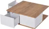 A square coffee table with a wood-grain top and white drawers is shown from a slightly elevated side angle. Produktbild-Vorschau
