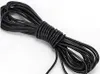 A coiled black cable on a white background. Podgląd zdjęcia produktu