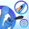 Close-up of a blue camping shower with a hand pressing a button on the handle, and a car charger adapter. Produktbild-Vorschau