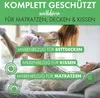 Two people playing on a bed, with text overlays indicating product features. Produktbild-Vorschau