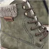 Close-up of a green Rieker boot with brown and white laces. Produktbild-Vorschau