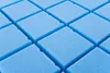 A close-up, angled view of a blue foam mattress with a diamond-patterned surface. Produktbild-Vorschau