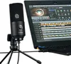 A black Fifine K669B microphone is shown on a tripod stand next to a laptop displaying video editing software. Podgląd zdjęcia produktu