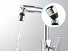 A close-up of a faucet with a water-saving adapter attached, showing water flowing through it. A magnified inset shows a detailed view of the adapter. Produktbild-Vorschau