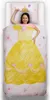 A young girl is lying on a bed with a duvet cover and pillowcase featuring a princess dress design. Podgląd zdjęcia produktu