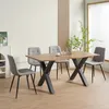 A dining room set with a wooden table and four gray upholstered chairs. Produktbild-Vorschau