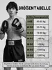 A boxer wearing boxing shorts and gloves stands next to a size chart for boxing gloves. Produktbild-Vorschau