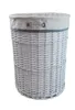 A white wicker laundry basket with a striped fabric liner and a small embroidered hippo logo. Produktbild-Vorschau