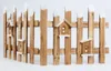 A wooden fence with small decorative birdhouses attached. Náhled obrázku produktu