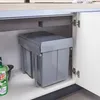 A pull-out trash bin system installed under a kitchen sink. Podgląd zdjęcia produktu