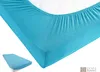 A close-up view of a turquoise fitted sheet on a mattress. Produktbild-Vorschau