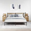 A bedroom scene with a bed, two nightstands, and abstract art on the wall. Náhled obrázku produktu