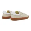 A pair of beige Lacoste sneakers with white accents and brown soles are shown from a side-rear angle against a white background. Produktbild-Vorschau