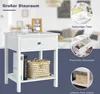 A white nightstand with a drawer and a shelf, shown with decorative items and text highlighting its features. Anteprima dell’immagine prodotto