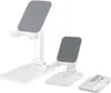 Three white, foldable phone and tablet stands of varying sizes are displayed against a white background. Náhľad obrázku produktu