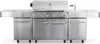 A stainless steel gas grill with multiple burners and side shelves, shown from the front against a white background. Podgląd zdjęcia produktu