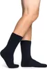 A pair of dark blue socks on a person's legs. Produktbild-Vorschau
